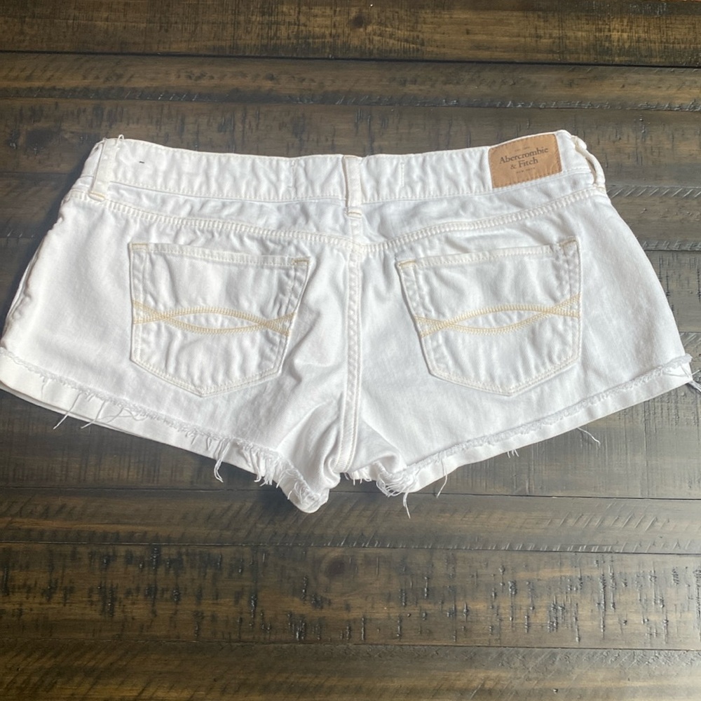 Women Abercrombie & Fitch white denim shorts. Distressed style. Like new Size 4